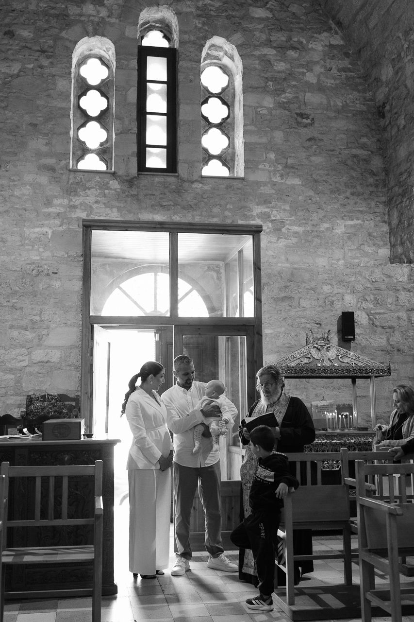 Greek orthodox baptism captured in Limassol church.