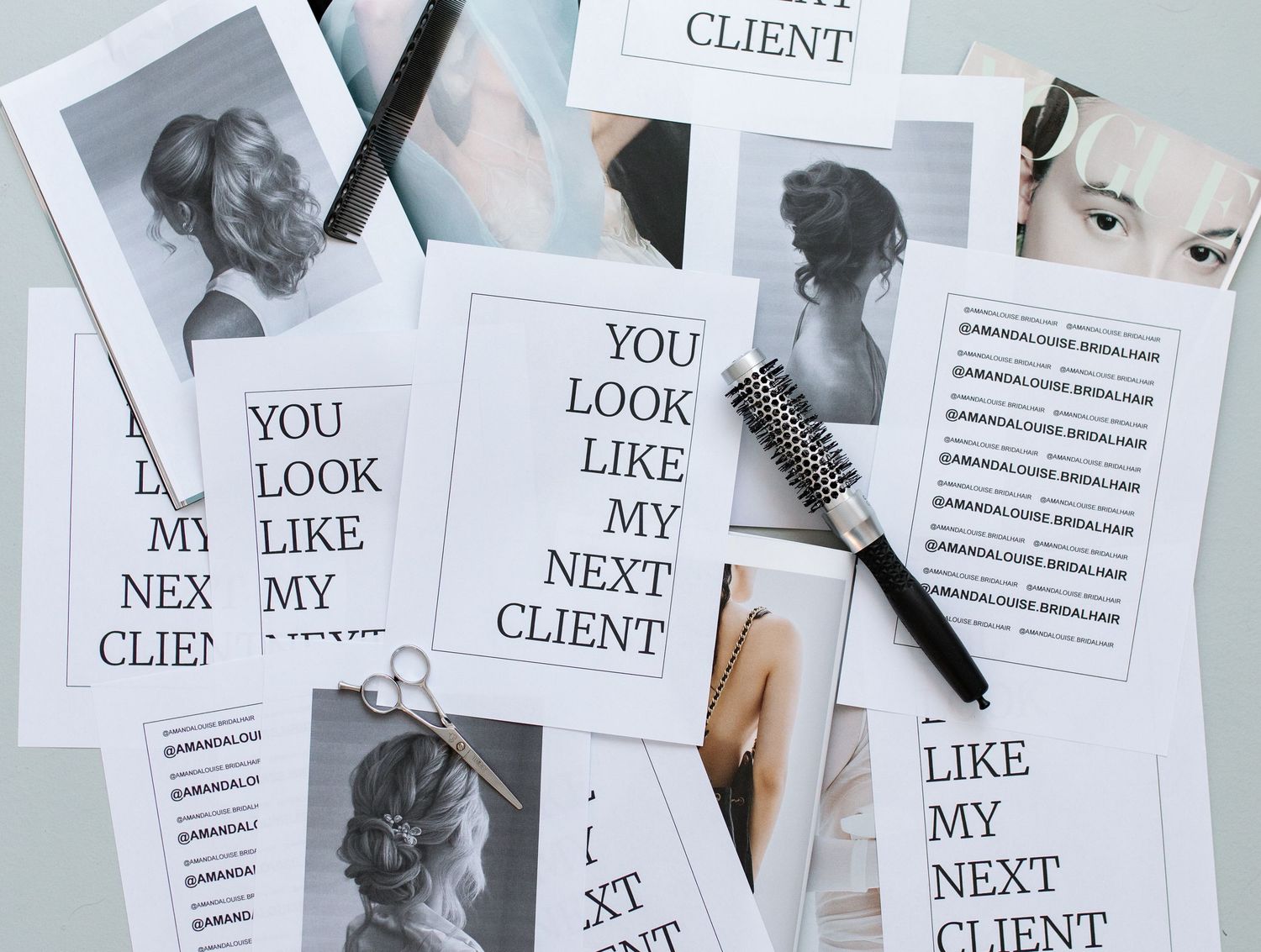 A flat lay arrangement of black and white client portfolio photos and text cards scattered on white background.