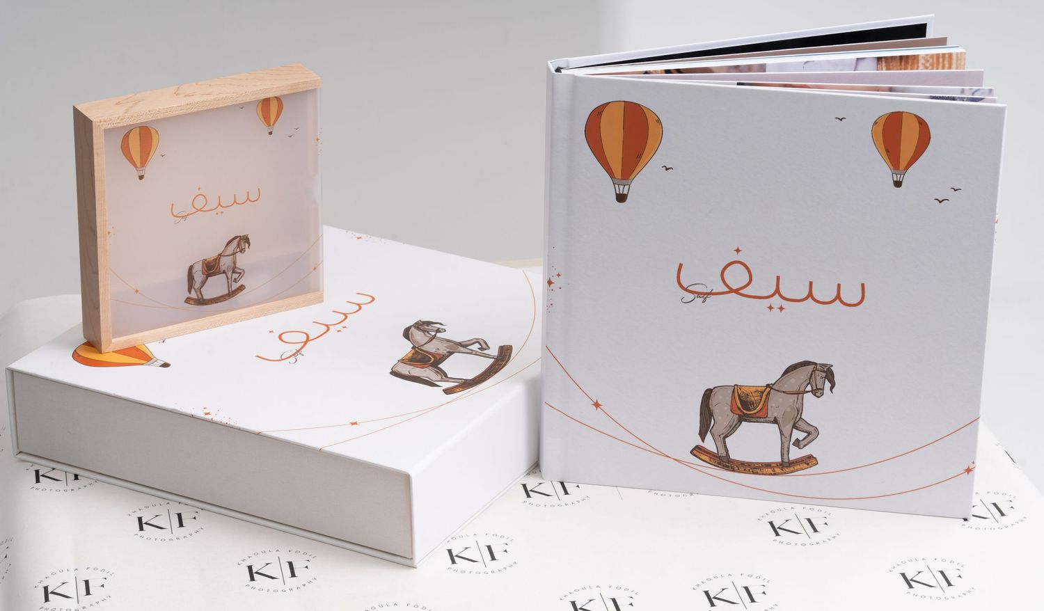 Modern minimalist book design featuring hot air balloon and rocking horse illustrations.