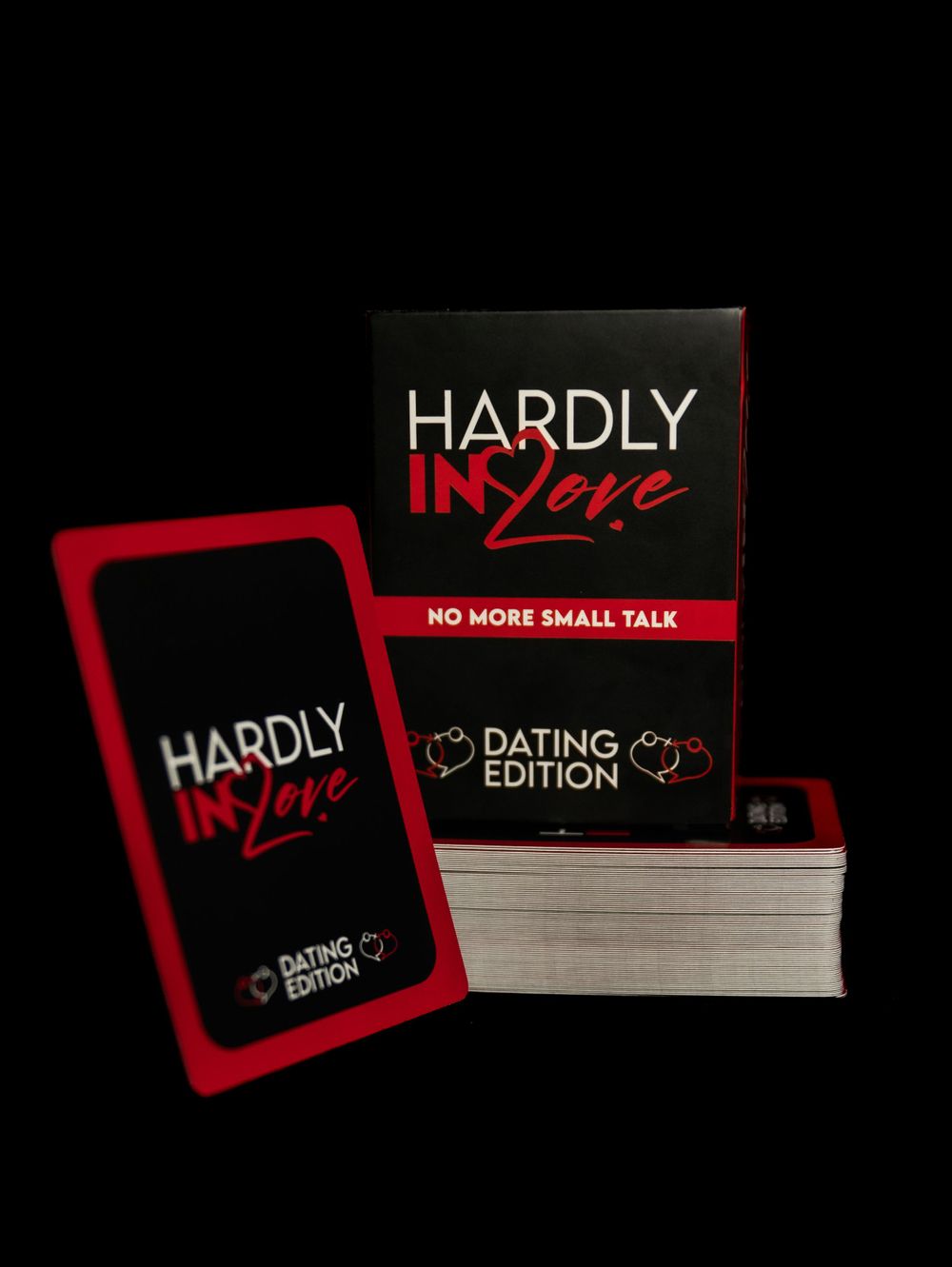 Black and red card game box titled 'Hardly in Love Dating Edition' displayed with cards.