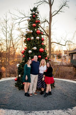 Large city Christmas tree makes for a great backdrop for family holiday card photos.
