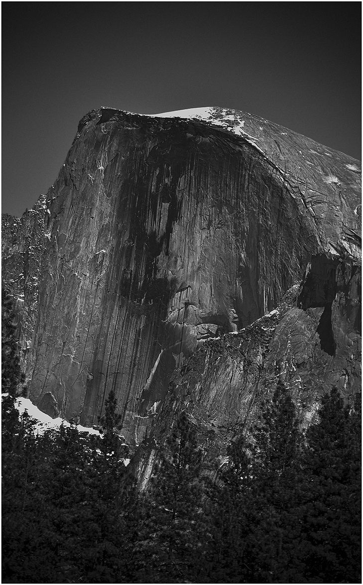 Black and white photograph of Half Dome rock formation in Yosemite National Park.