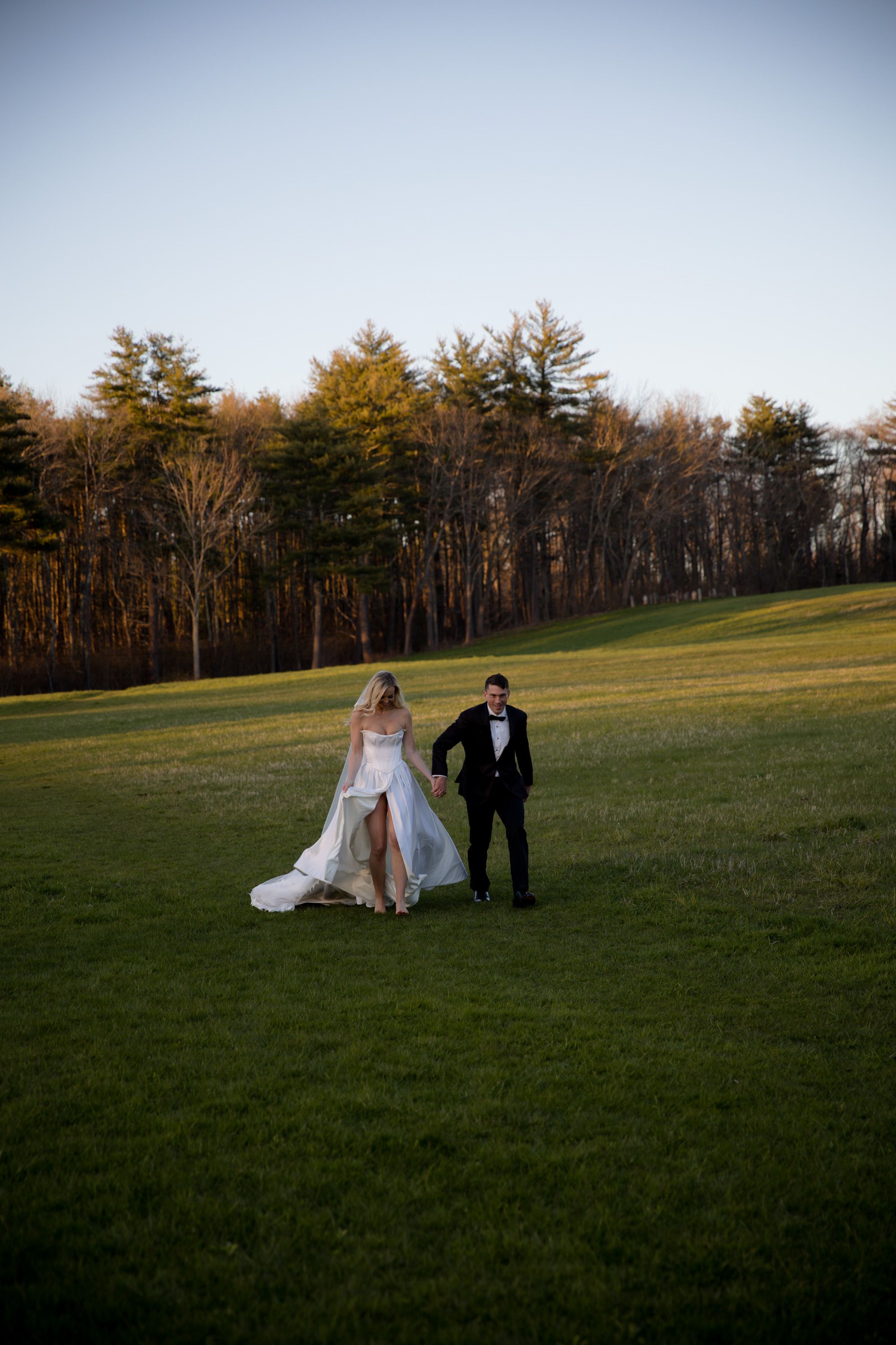 color wedding photograph of bride and groom in field