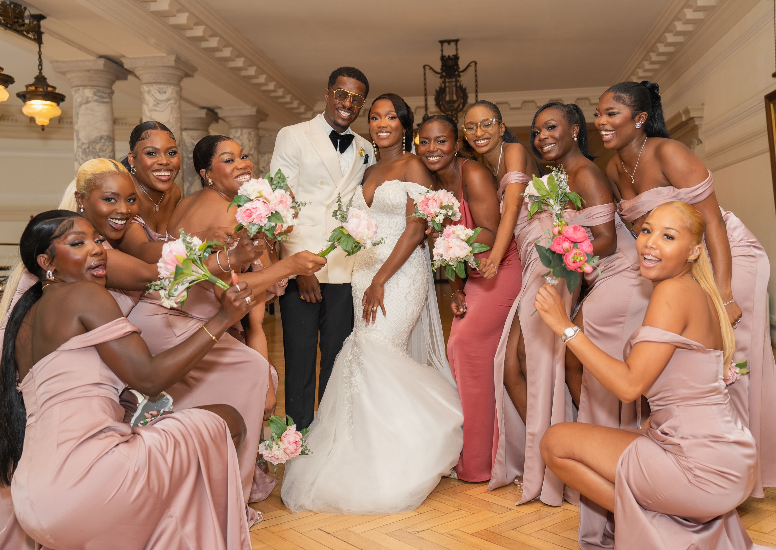 braidmaid and groomsmen with bride and groom