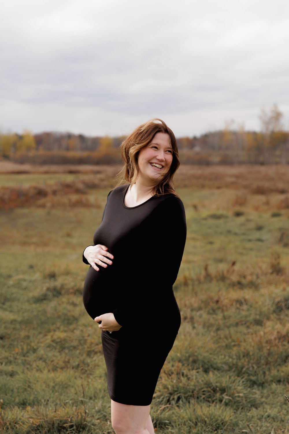 A series of outdoor maternity photos showing a woman in black against a rustic autumn field background.