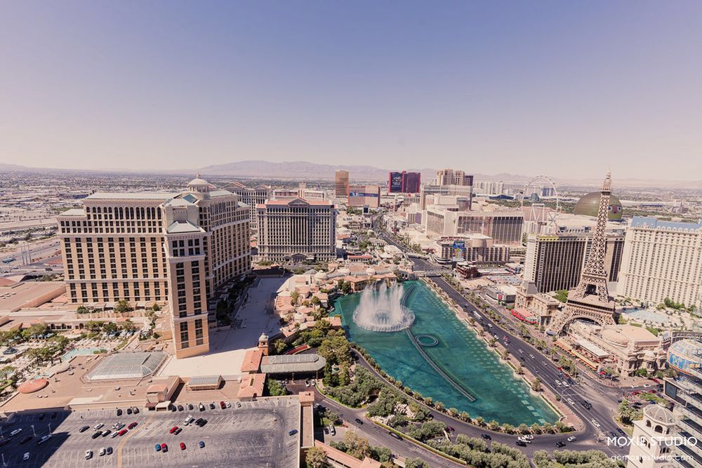 Aerial panoramic view of Las Vegas strip showing multiple luxury hotels and casinos along the boulevard.