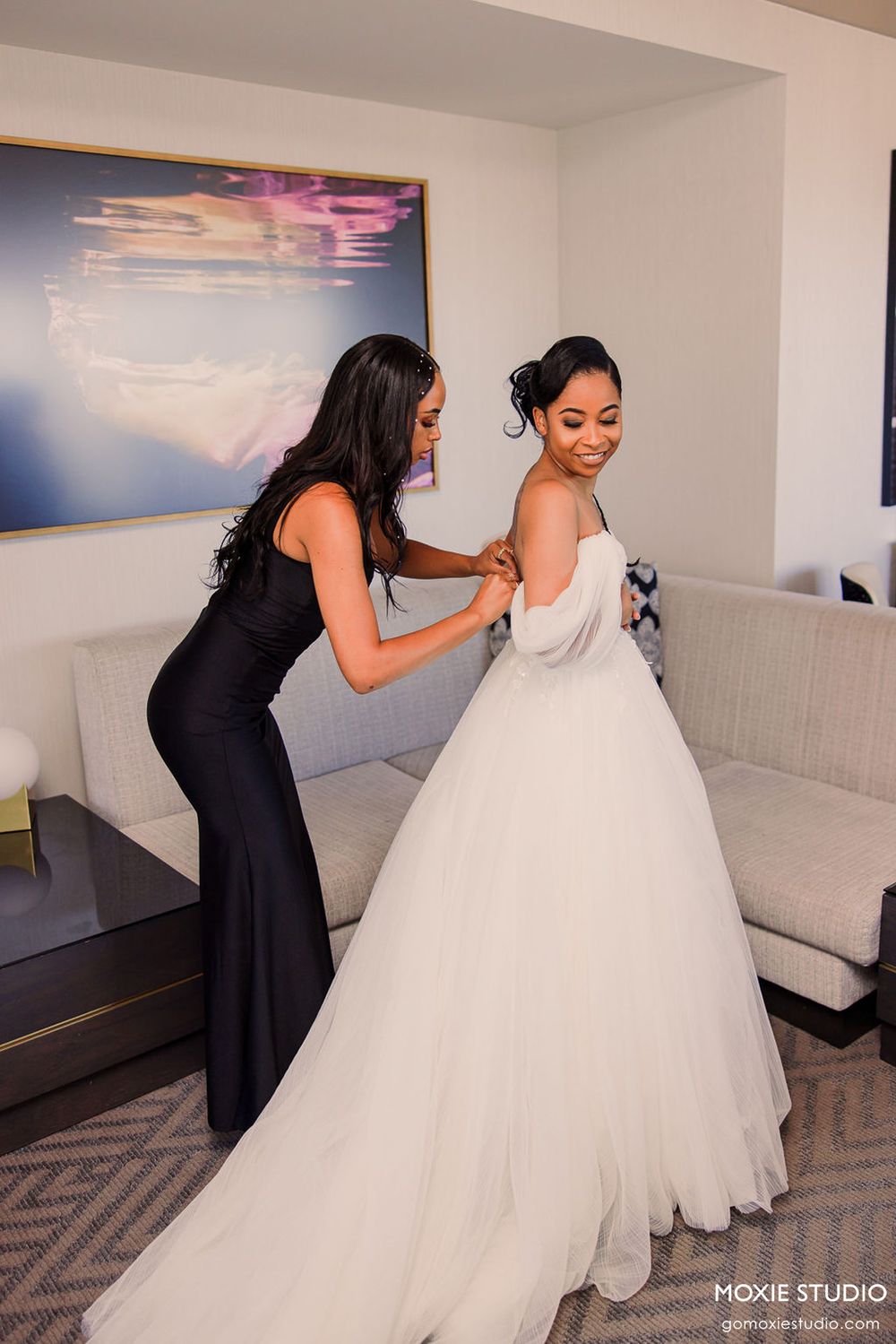 A person in a black dress helps adjust the layers of a white wedding gown in a sequence of preparation photos.
