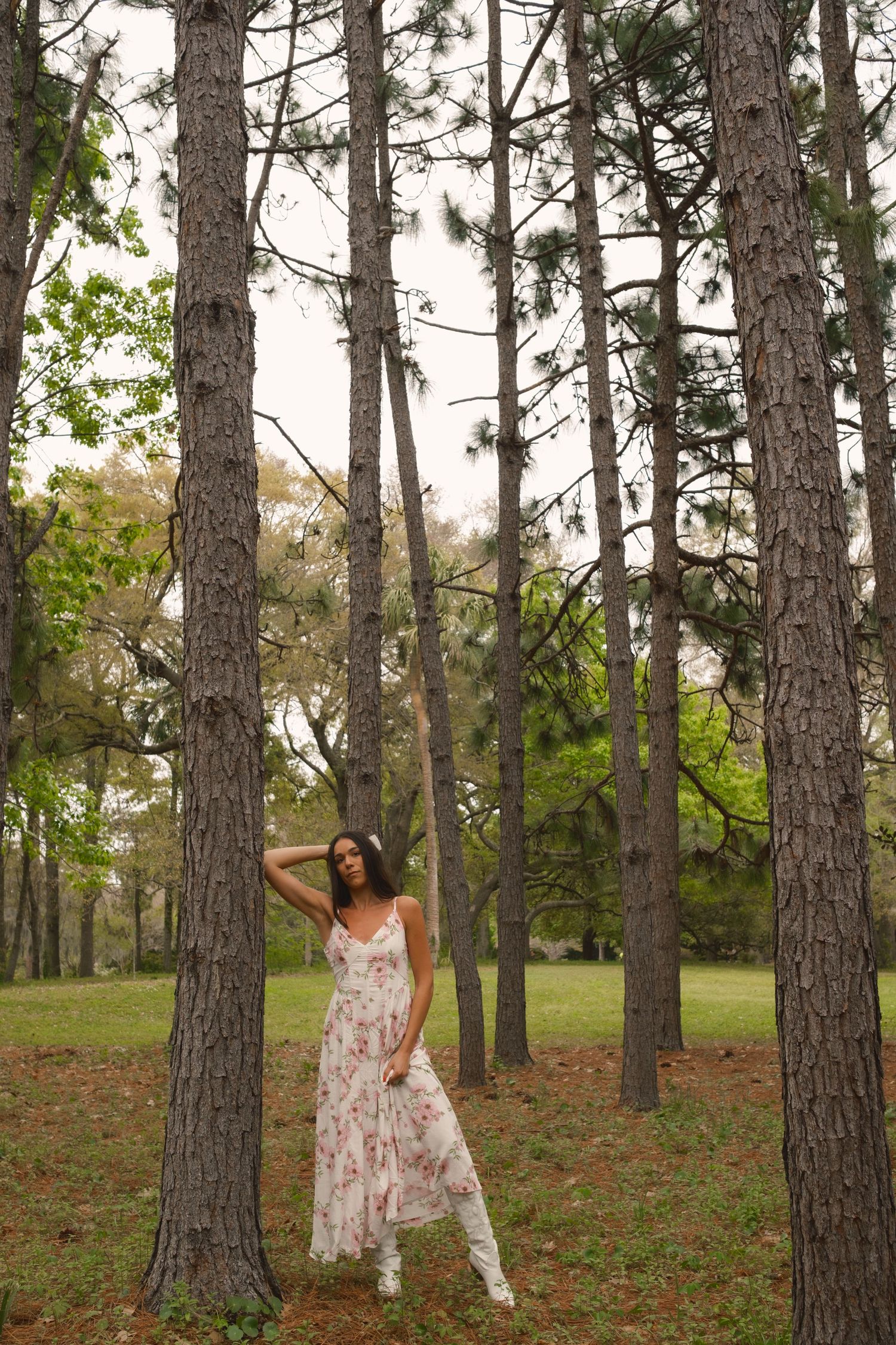 Hampton Park portrait session of woman by tall trees in Charleston SC