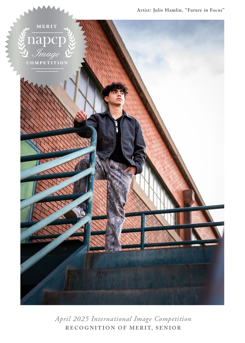 Black and white artistic portrait of someone in a jacket on metal stairs against a brick building exterior.