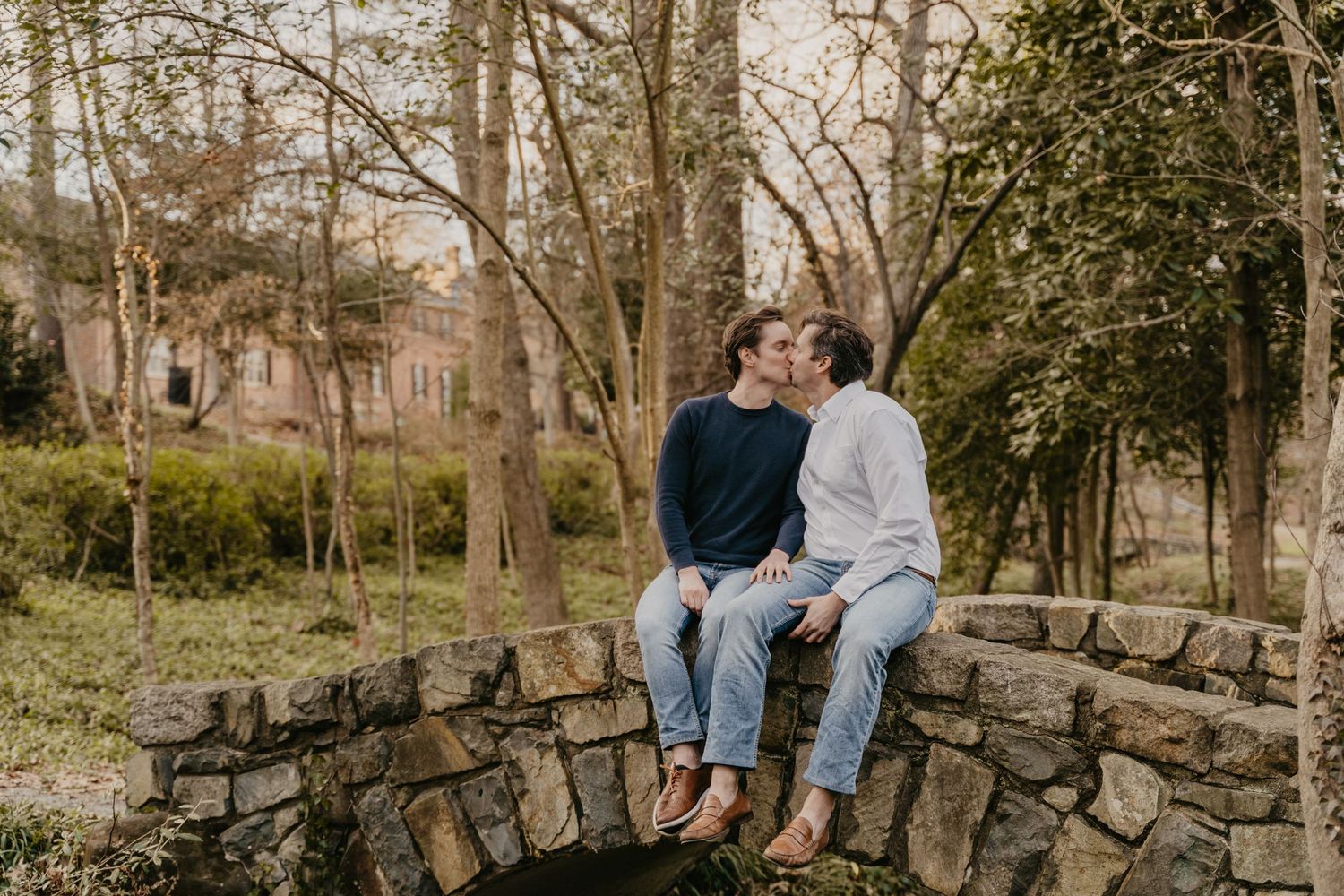 gay couple kissing on a bridge in north carolina