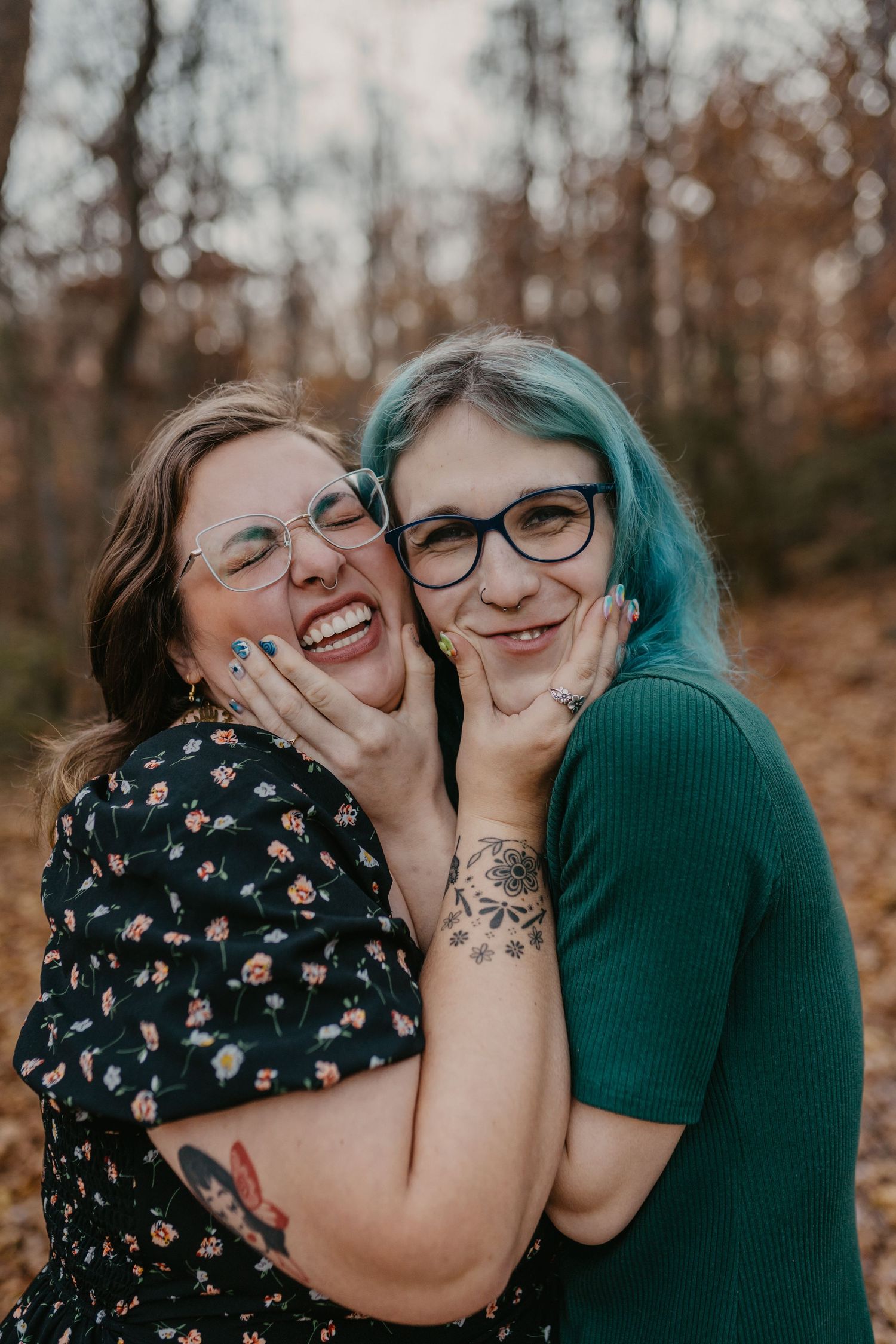 A queer couple in the woods in autumn making silly faces
