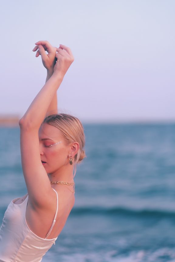 Bride with rhinestones on her makeup on the beach