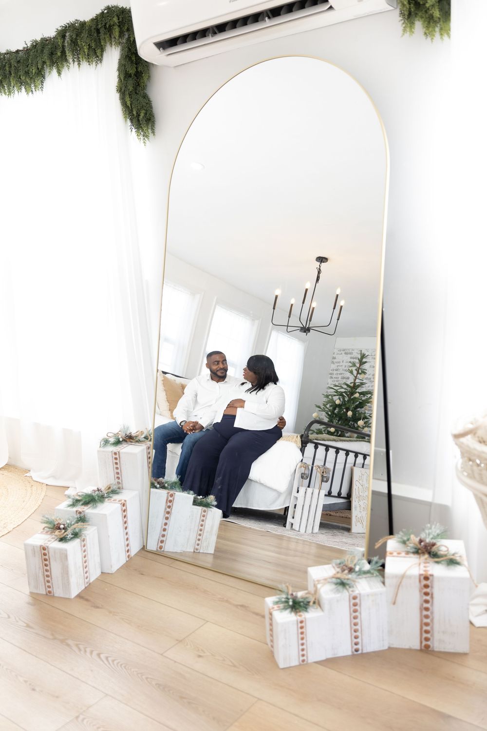 Four minimalist white interior design photos showing a bright room with wood flooring and white decor elements.