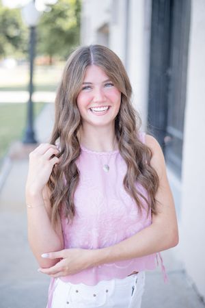 A series of four candid portrait photos showing someone in a pink sleeveless top against a light outdoor background.