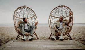 Series of romantic photos showing couple sitting in hanging wicker chairs on beach. . photographe mariage lgbt Bordeaux gironde