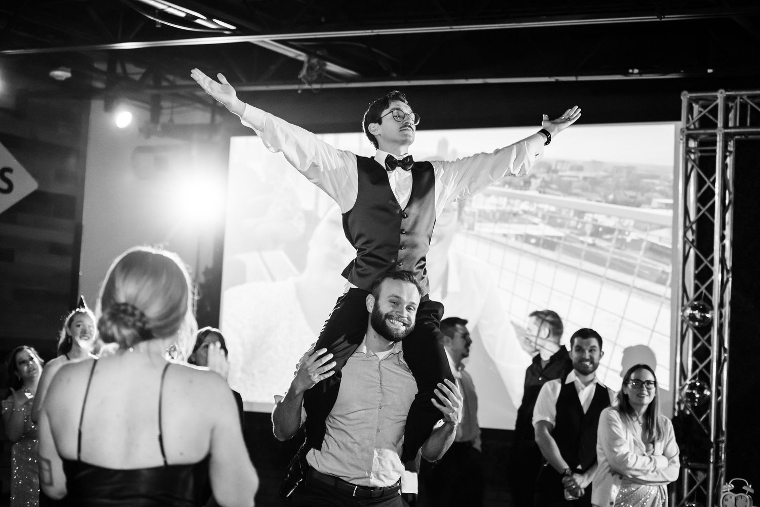 Wedding reception dance floor scene at Blame her Ranch. The bride in a lace wedding dress dancing holding a glow stick