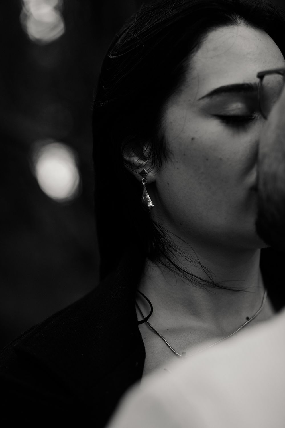 a couple kissing intimately during their anniversary photo session