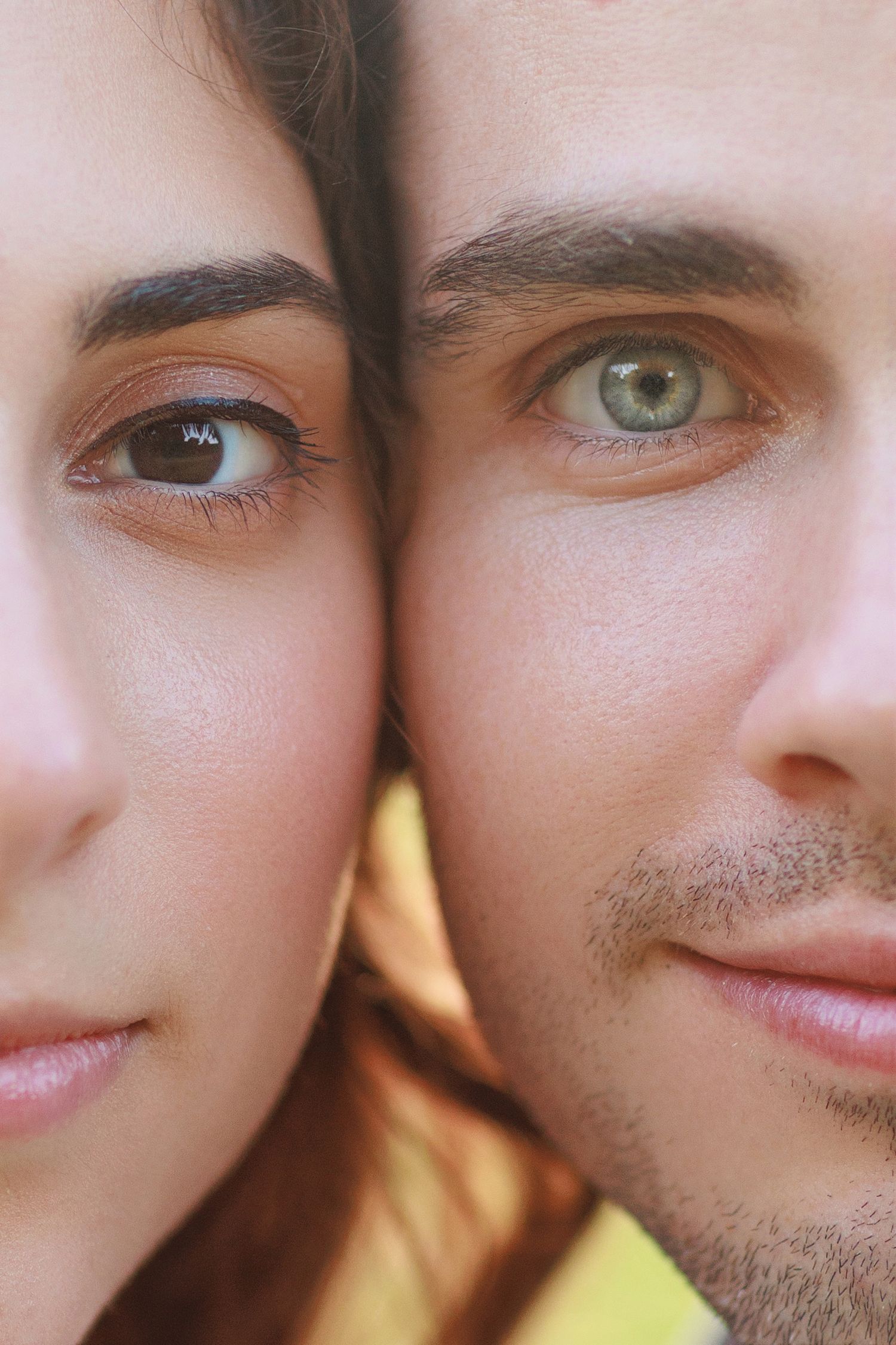 Extreme close-up portrait showing two pairs of eyes with different colors.