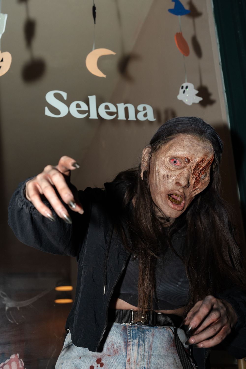 Zombie eating a pizza.
