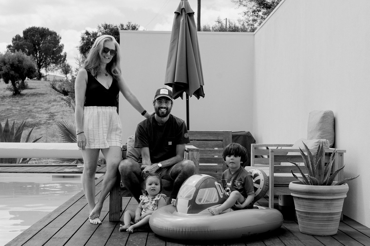Family enjoying outdoor fun on a summer day with candid photos showing playful moments and interactions.