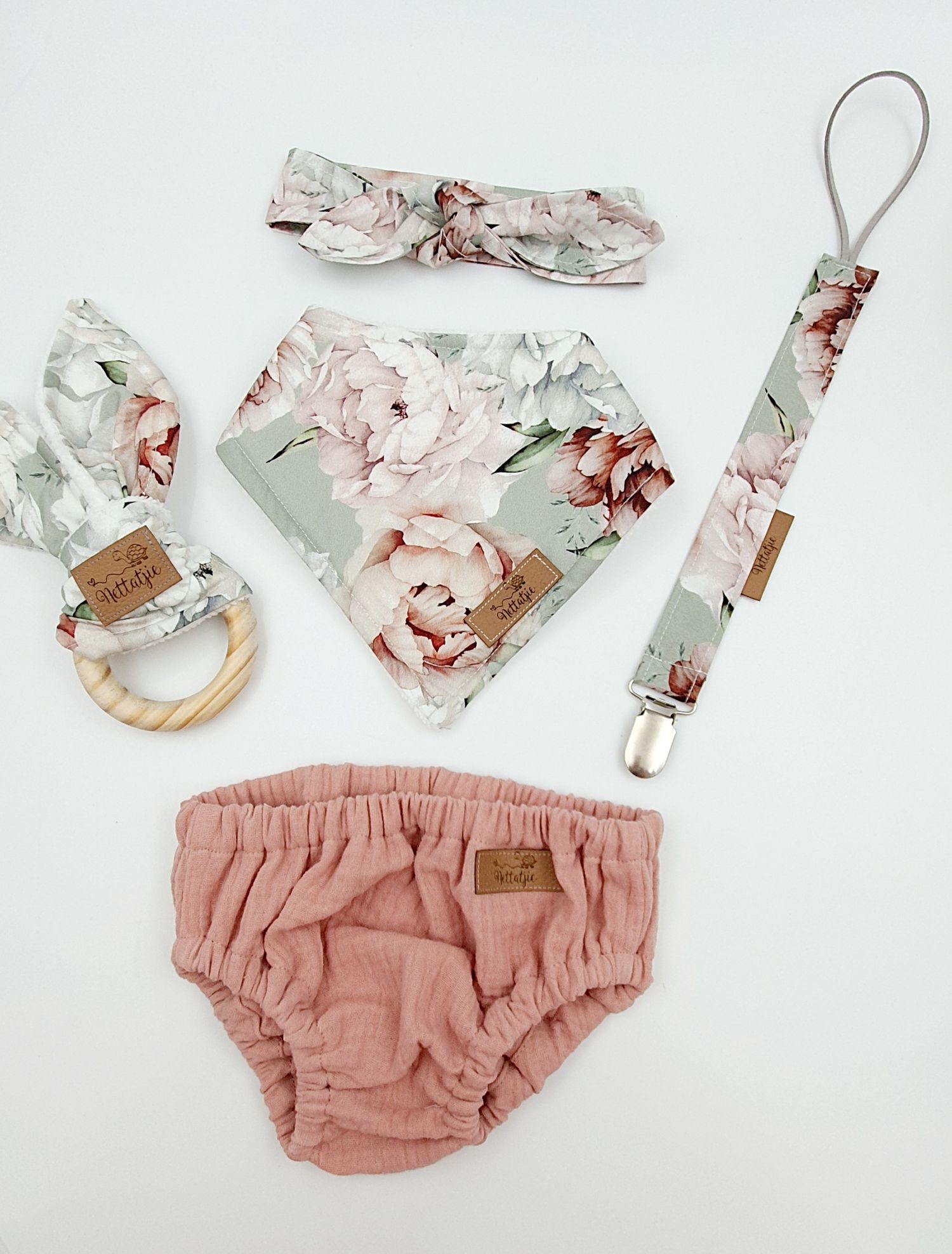 Sage green floral baby girl gift set with headband, bib, pacifier clip, teether, and dusty rose bloomers.