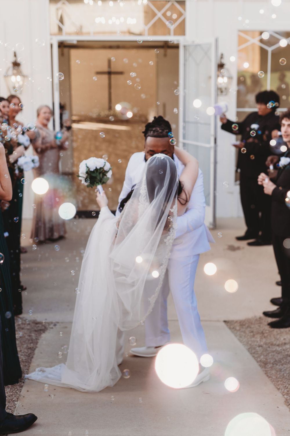 A series of wedding photos showing guests blowing bubbles as a couple exits their ceremony at a church venue.
