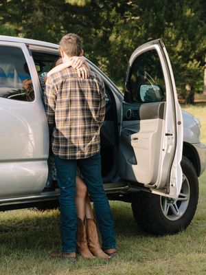 Multiple shots showing casual moments around a parked silver truck on grass.
