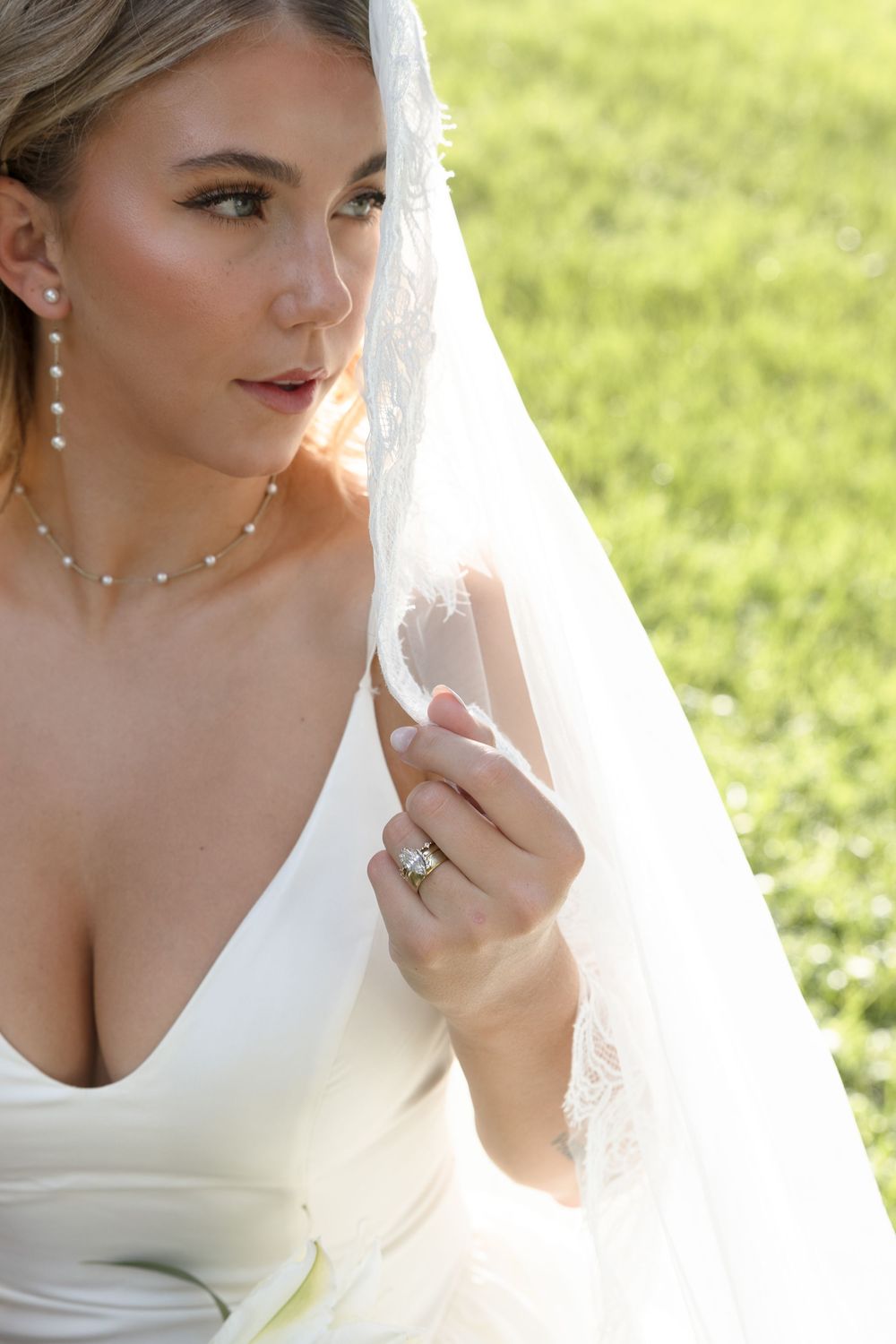 A set of four close-up photographs showing a bride's face in white dress and veil against an outdoor garden background.