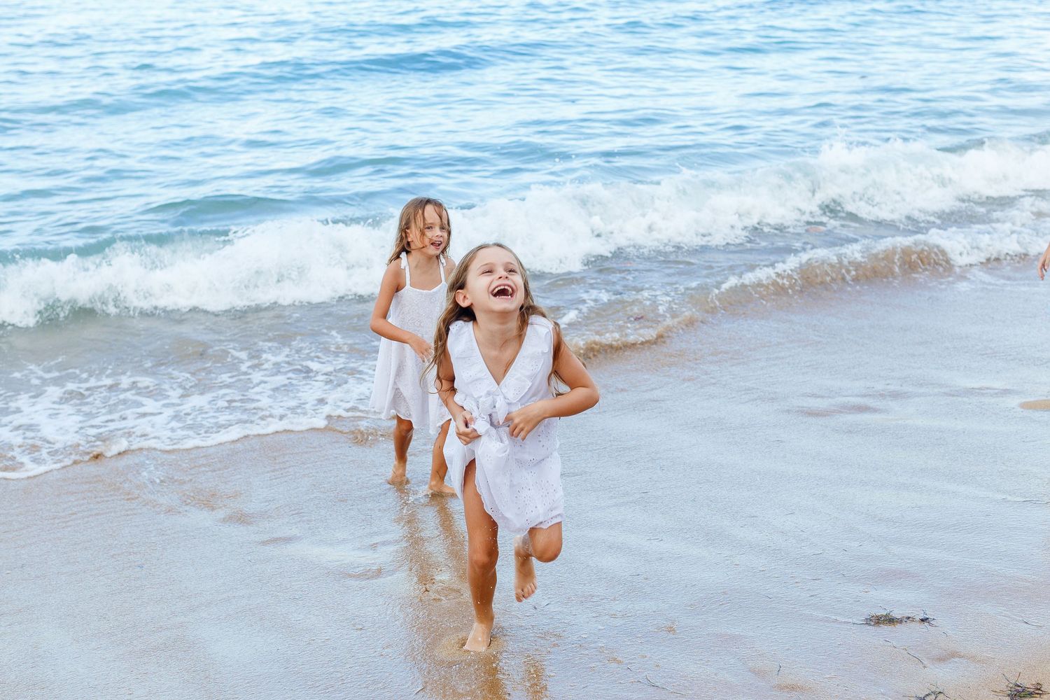 Two girls on the beach in Dorado, Puerto Rico.