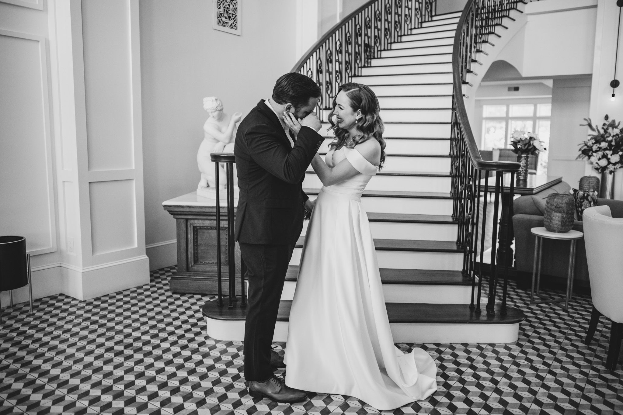 Wedding couple's first look reaction photographed in sequence on elegant staircase.