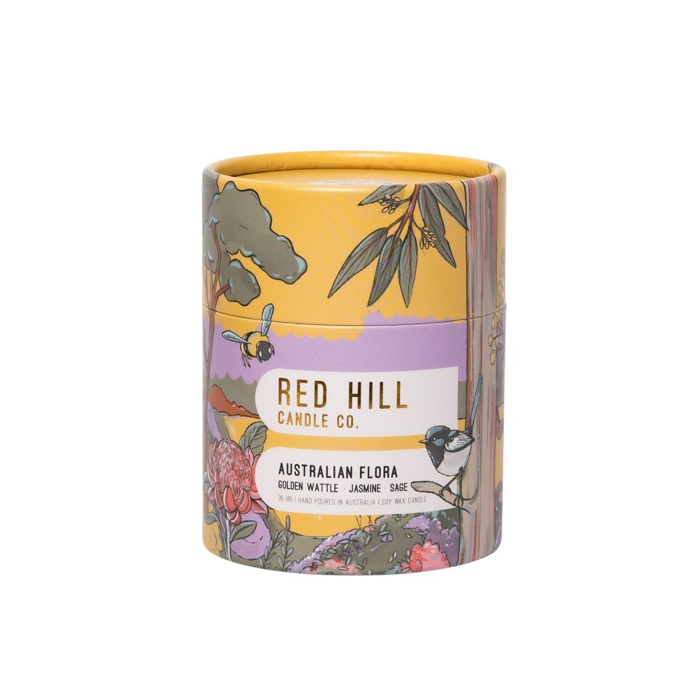 Decorative cylindrical package with Australian flora design in yellow and purple color scheme.