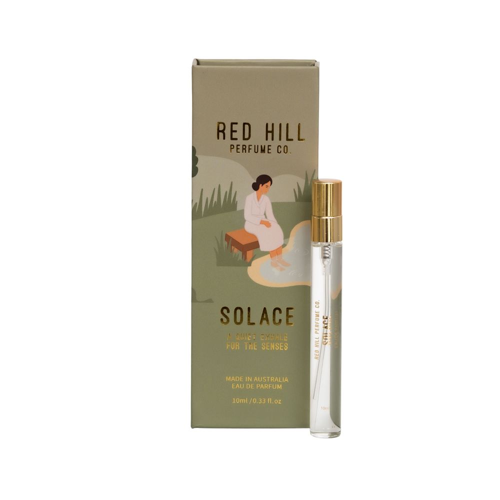 Perfume sample bottles and boxes from Red Hill and Solace fragrances displayed on a neutral background.
