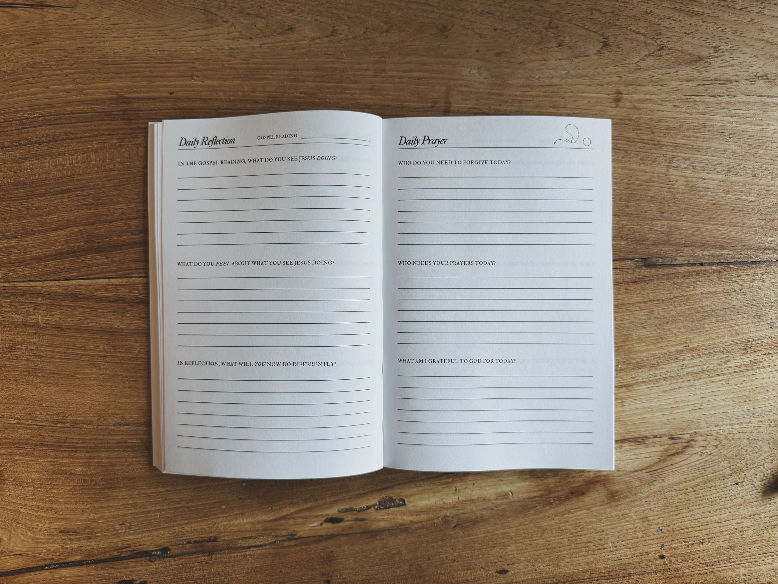 One open blank notebook with lined pages arranged on a wooden surface showing different angles and perspectives.