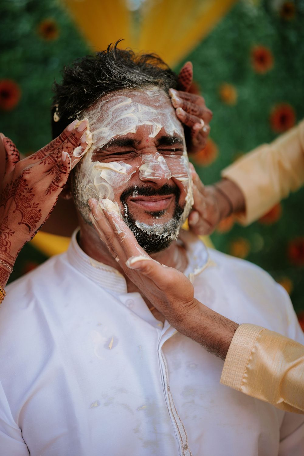 Someone gets shaving cream applied to their face in preparation for a grooming session.  Hilton Pearl River NY