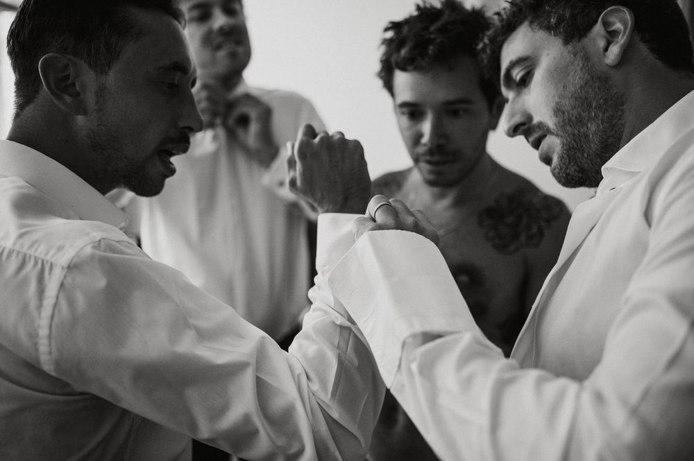 Black and white documentary-style photographs showing intimate moments at what appears to be a social gathering or party.