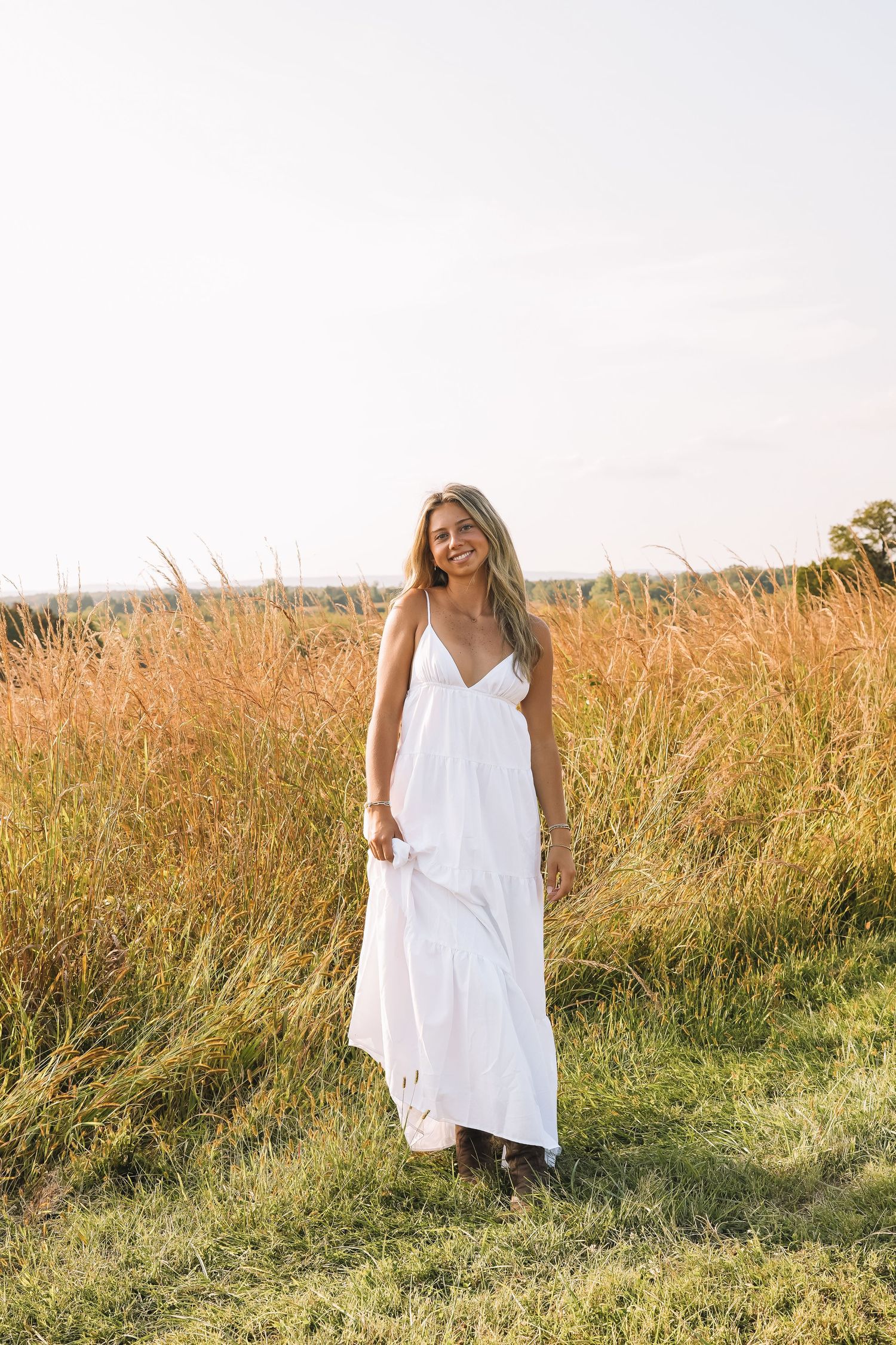 Graduation portrait session in the Manassas, Virginia - beautiful tall grass field | Senior photos by Alina Phillips Photography.