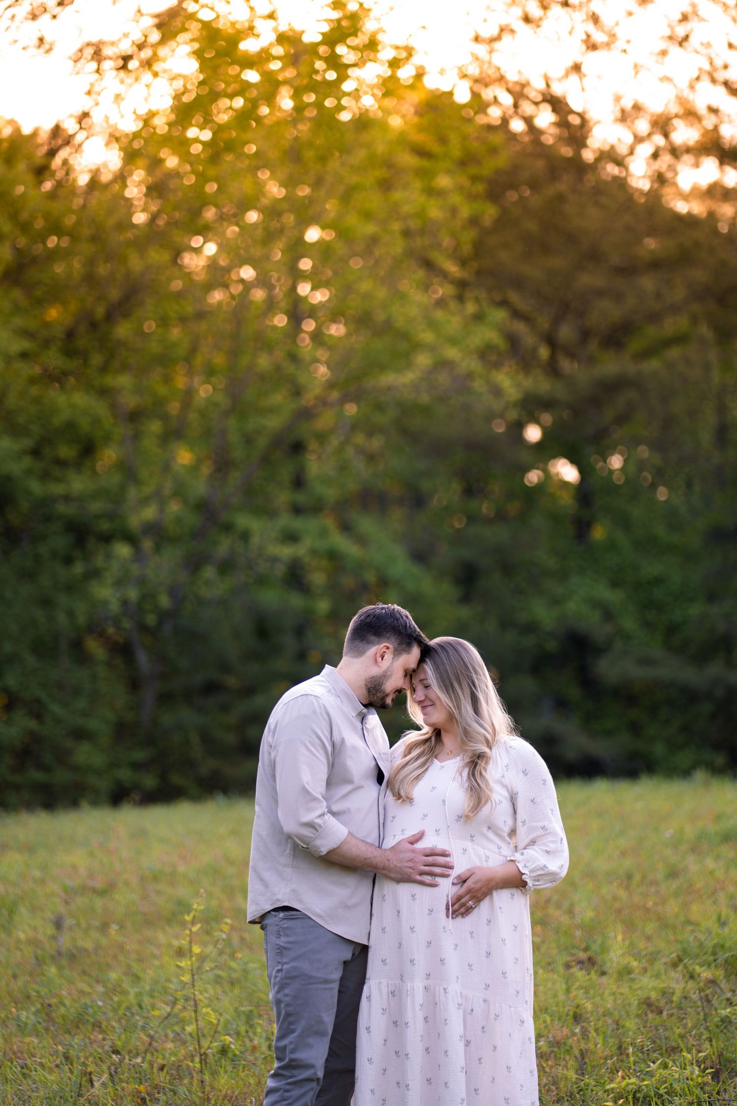 Pregnant wife with husband at a Marietta park maternity session