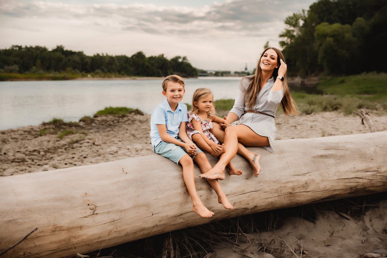Vanessa Phillips Photo - Billings, MT Photographer - A mom with her son and daughter sitting on a large log.