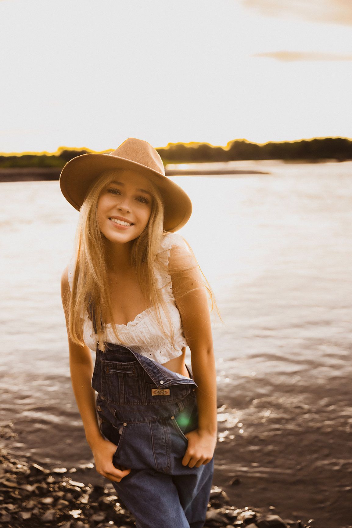 Vanessa Phillips Photo - Billings, MT Photographer - A senior photo of a girl in a hat standing near the Yellowstone River.