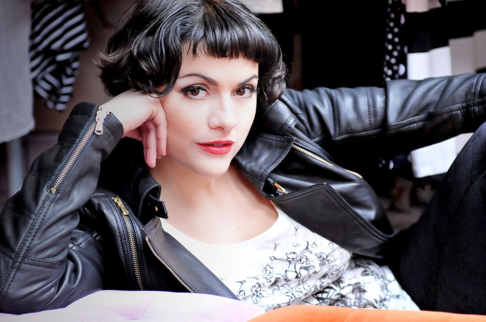 Vintage-inspired portrait with black and white lace details and leather jacket.
