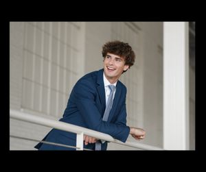 smile teen male in suit