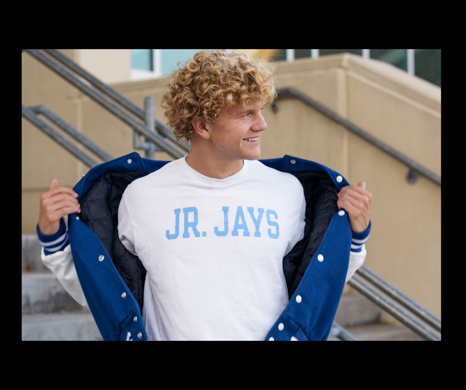 teen male opens jacket like superman