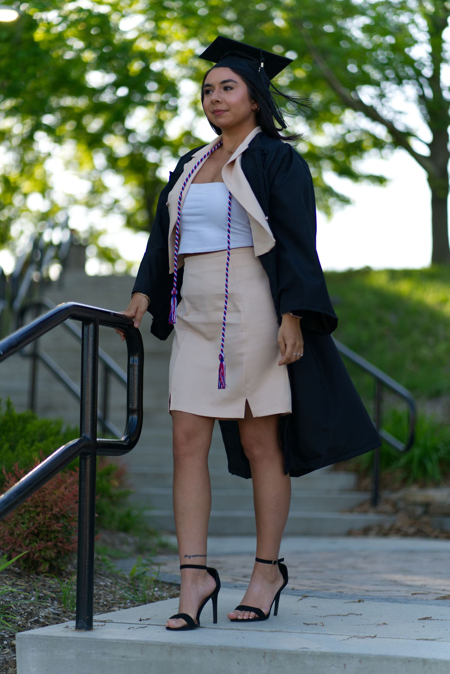 Graduation Photoshoot for new graduate, outdoors on campus