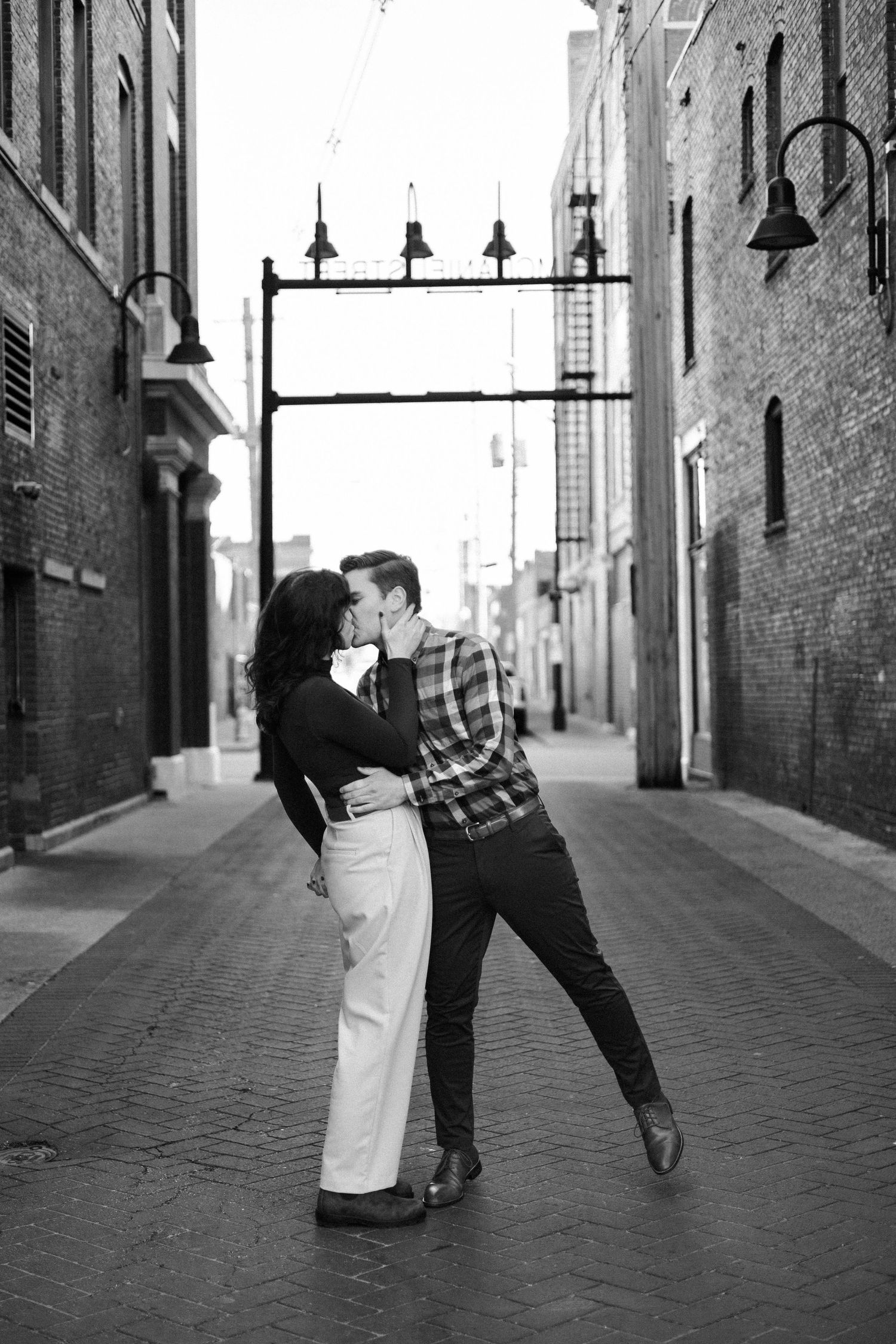 downtown springfield missouri engagement sessions by hotel vandivort, couple kissing