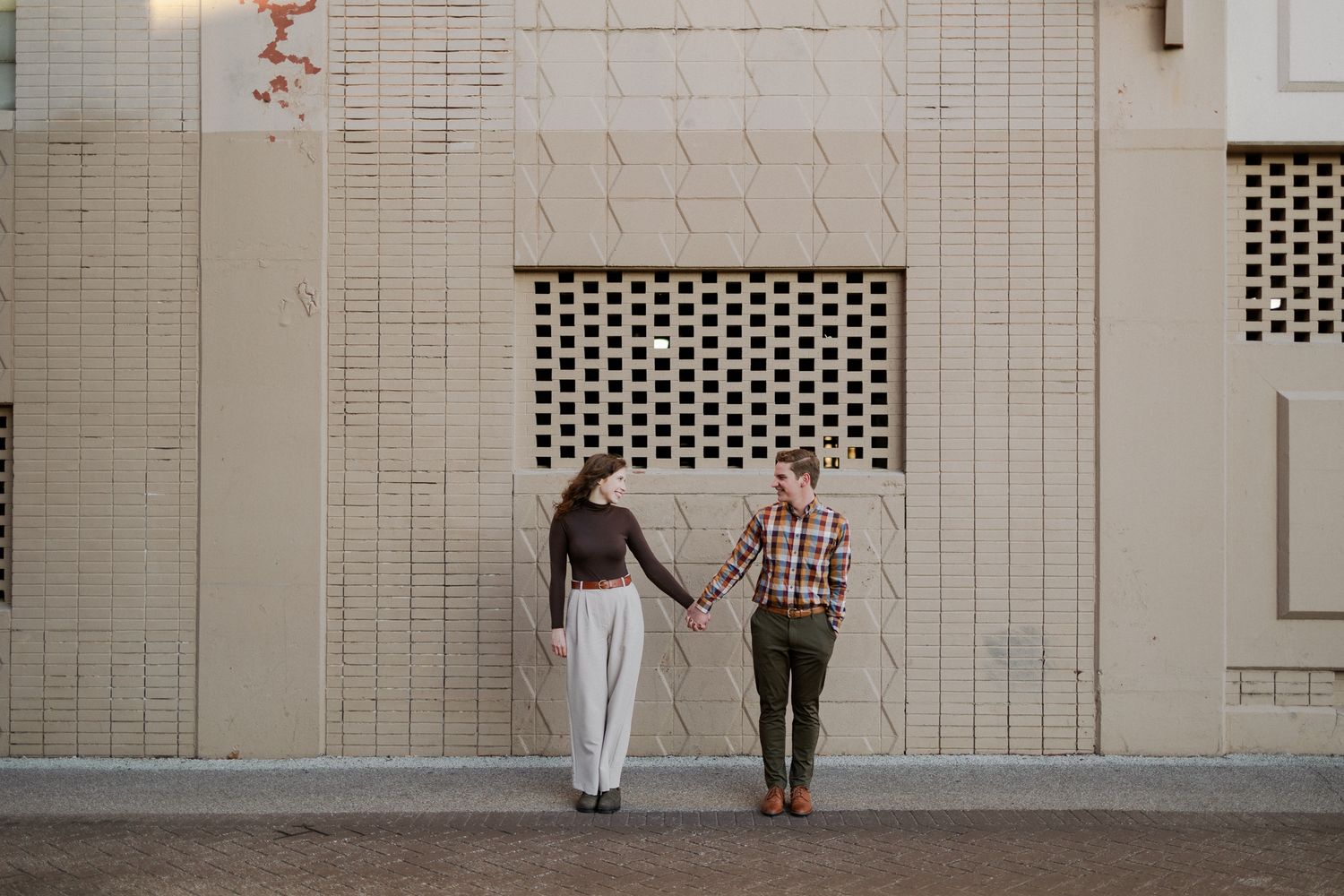 downtown springfield missouri engagement sessions by hotel vandivort, couple holding hands