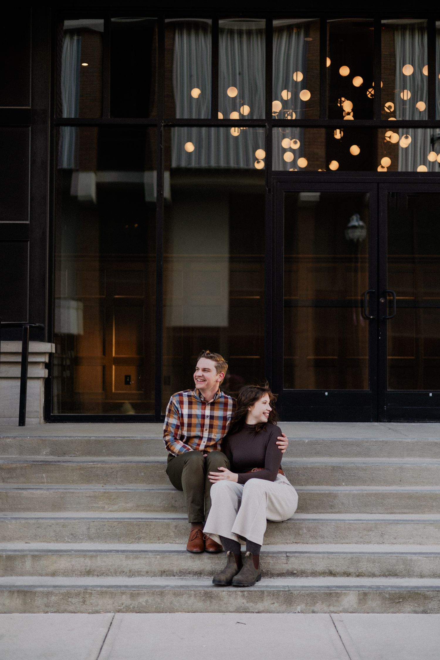 downtown springfield missouri engagement sessions by hotel vandivort, couple sitting on stairs