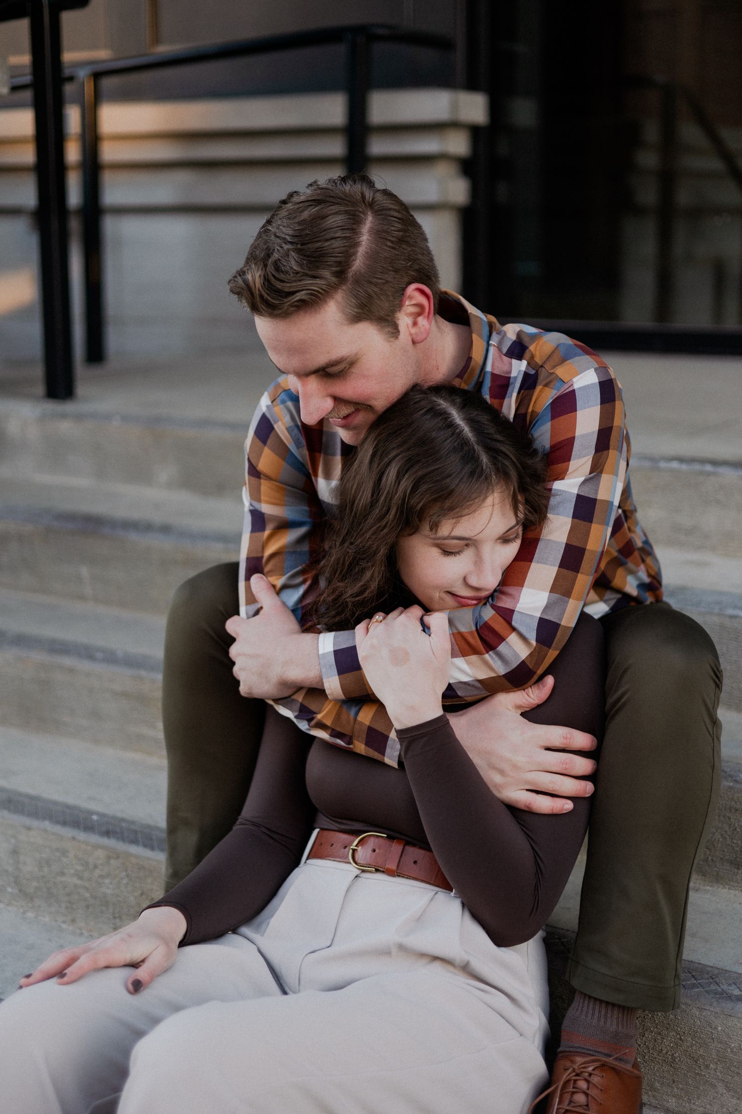 downtown springfield missouri engagement sessions by hotel vandivort, couple hugging