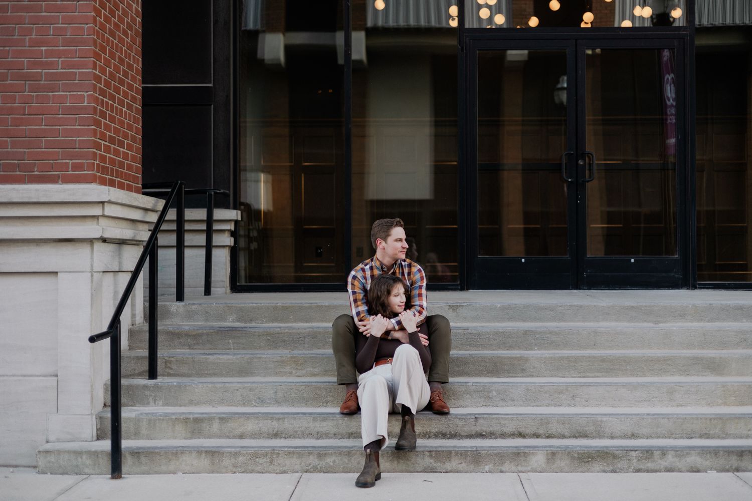 downtown springfield missouri engagement sessions by hotel vandivort, couple hugging candid