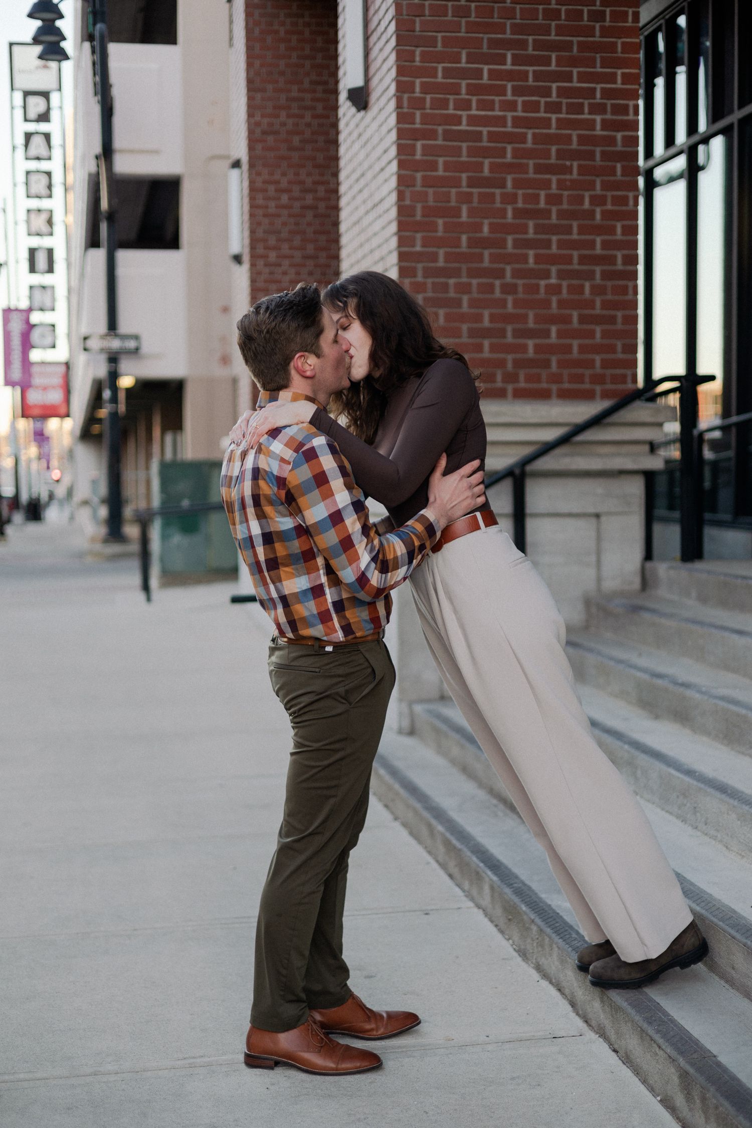 downtown springfield missouri engagement sessions by hotel vandivort, candid posing on the stairs, kissing