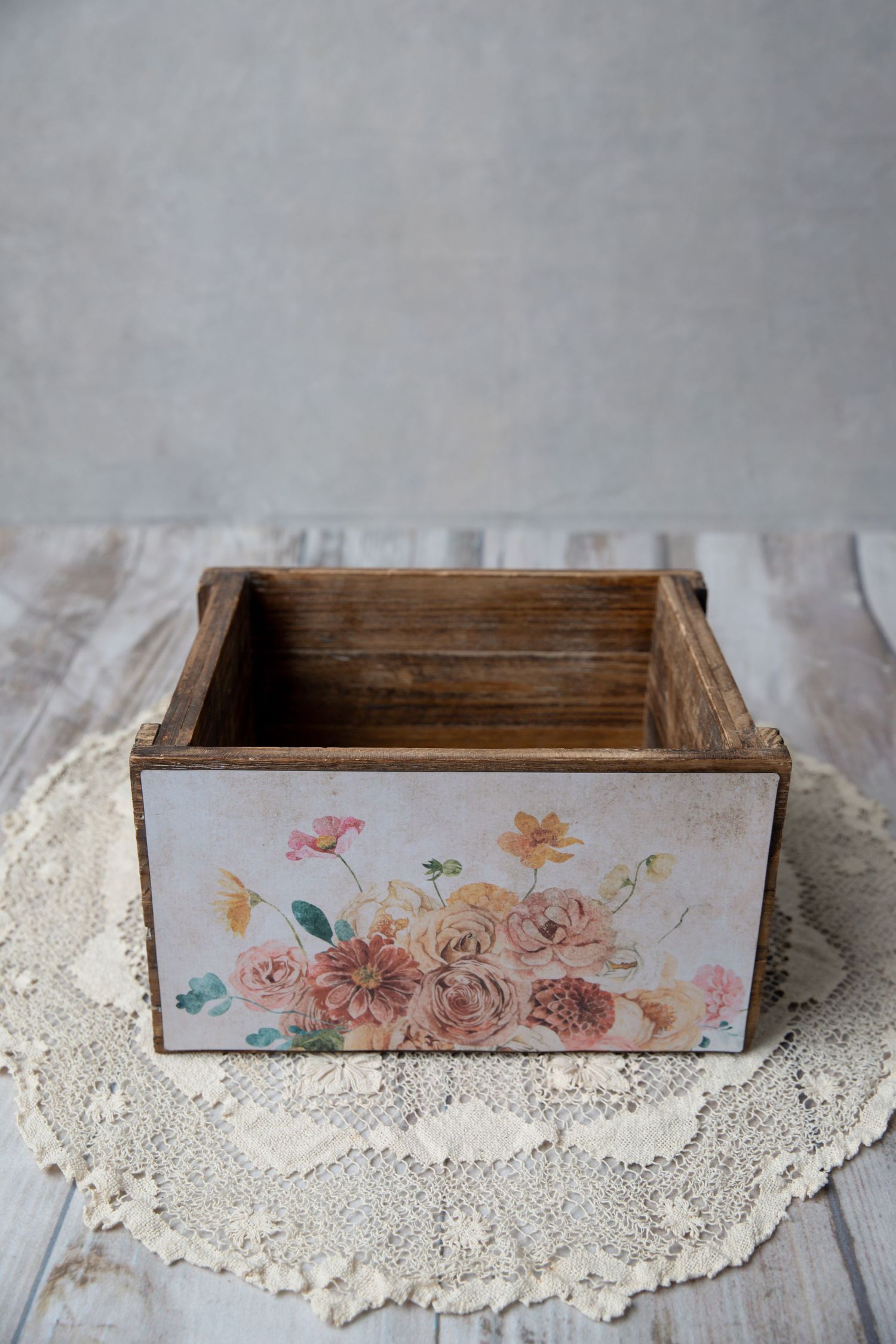 Rustic wooden crate box with vintage floral rose decoupage design on lace doily.